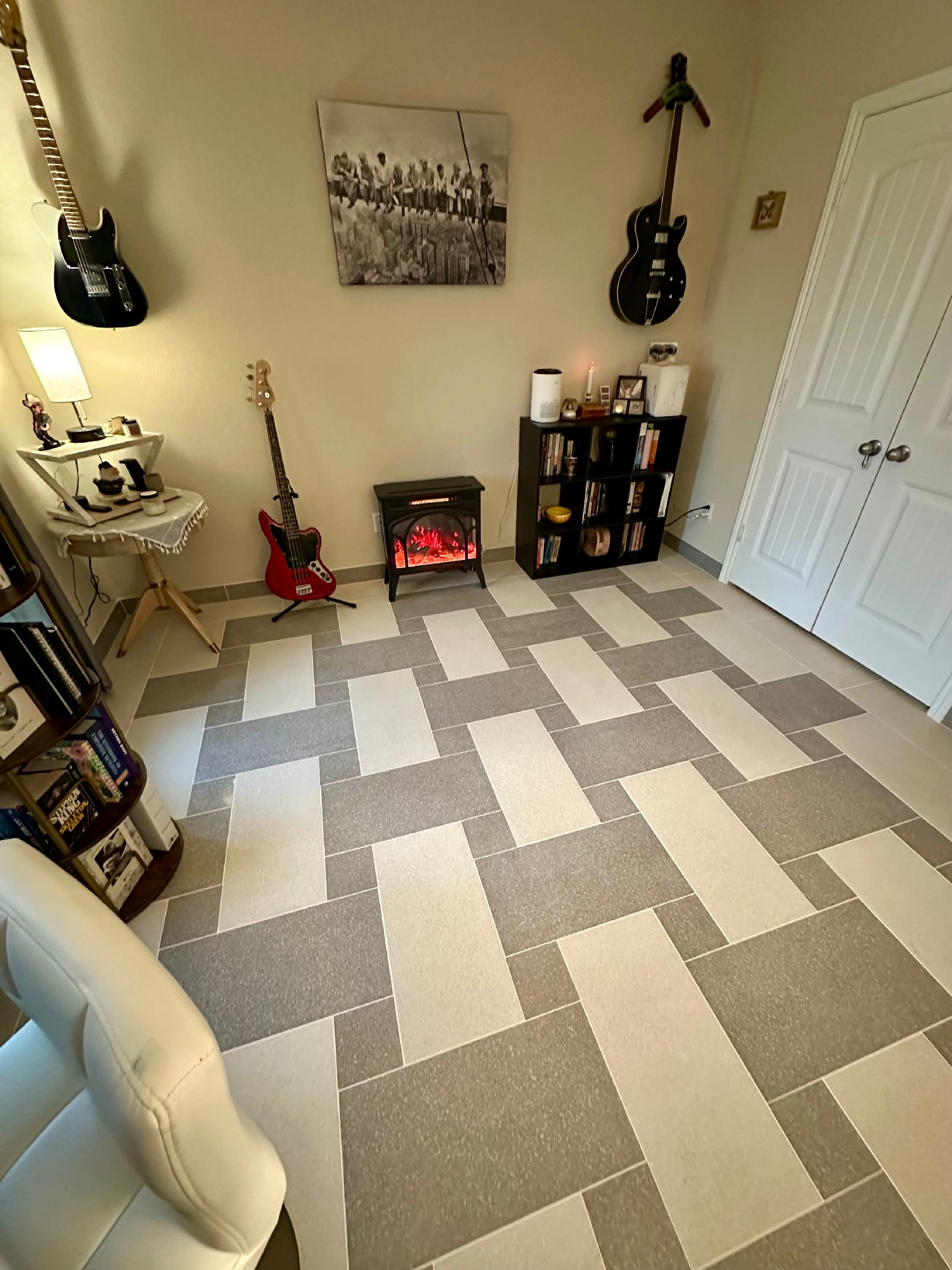 Game room floor in a two-tone basketweave pattern using soft gray and cream porcelain tile.