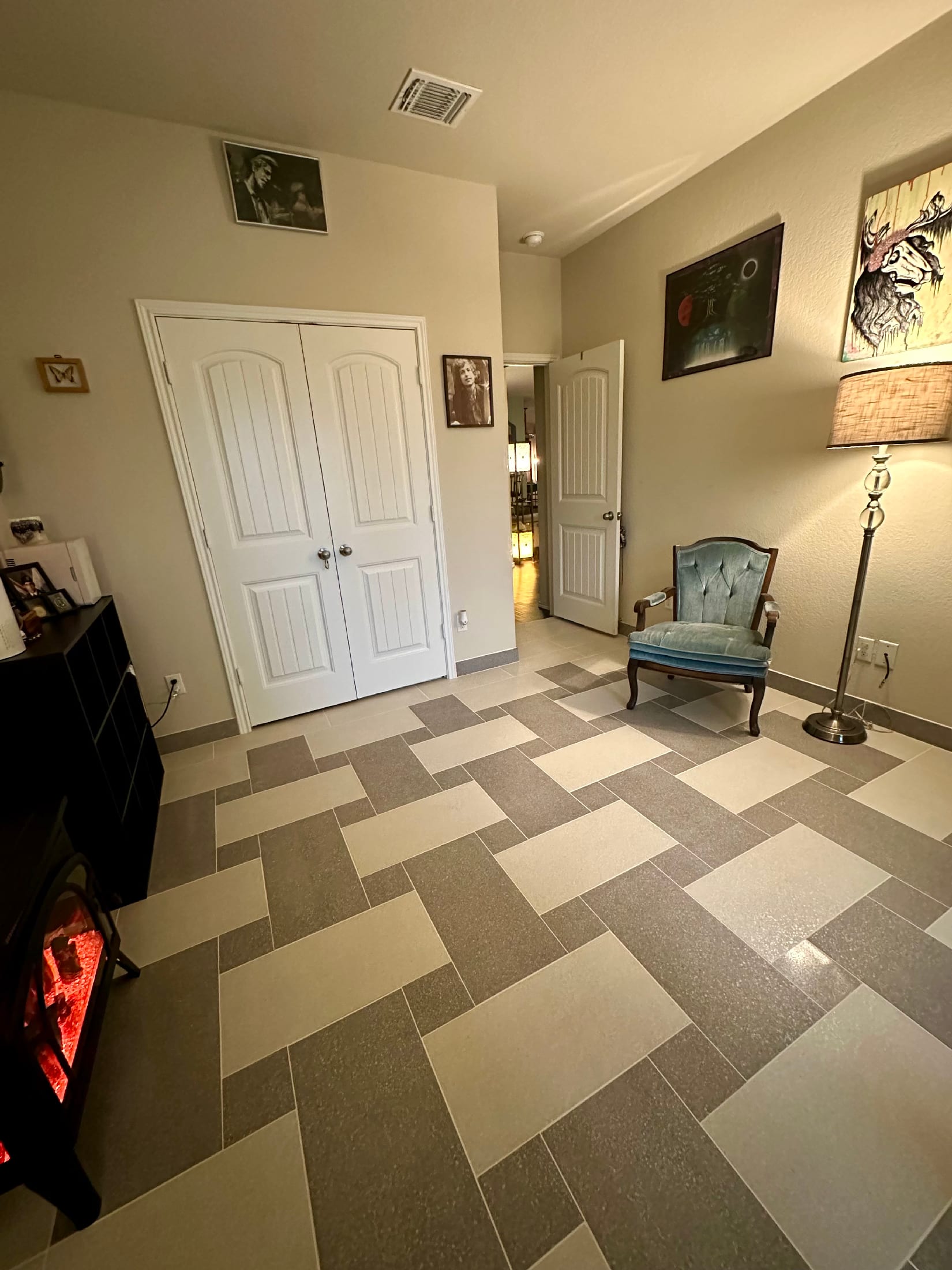 Entry hall with a basketweave-pattern gray and cream porcelain tile floor.